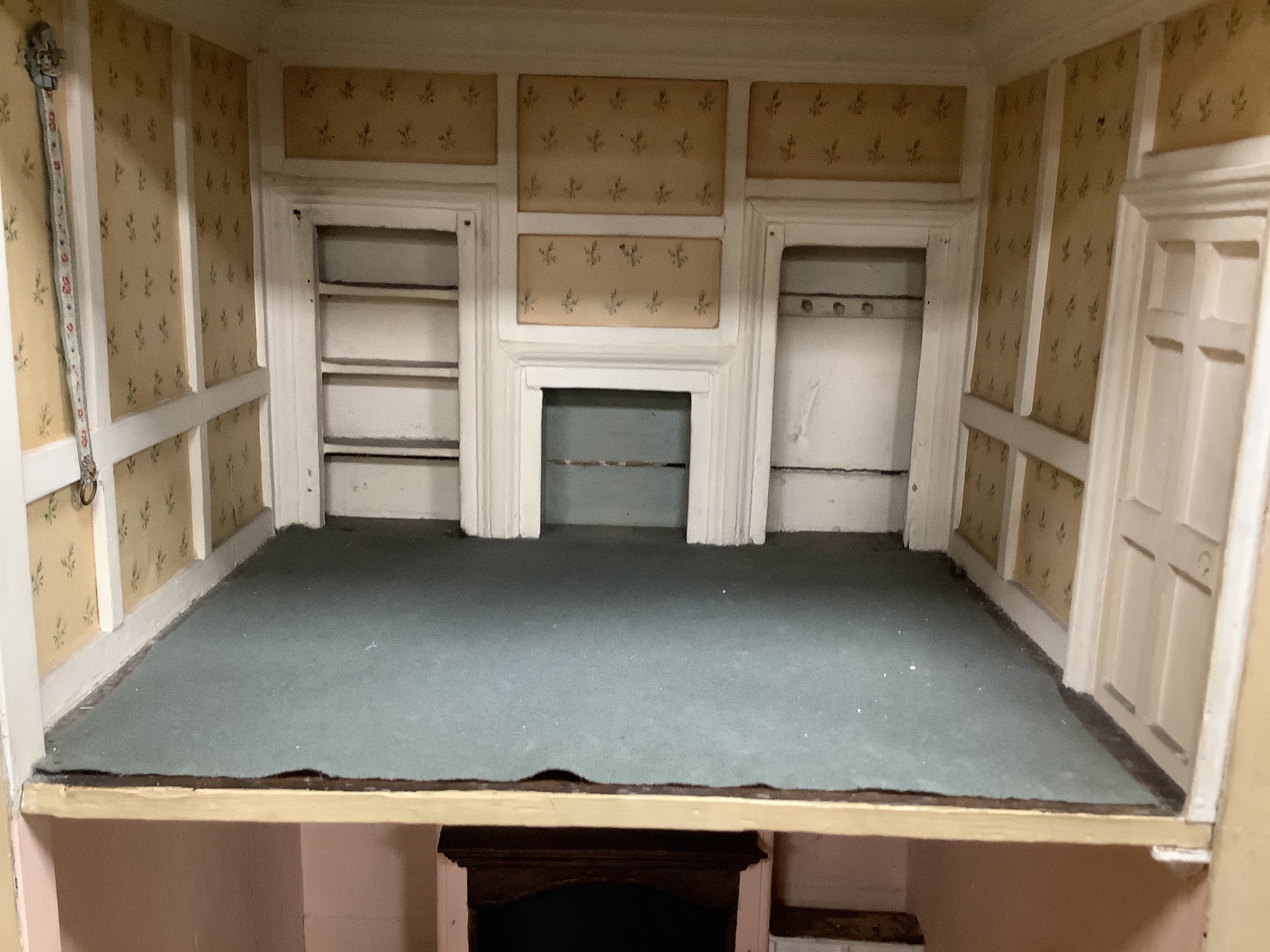 An early 19th century painted doll's house with block work facade enclosing a four room interior with central staircase, to be sold with assorted later furniture and accessories, width 117cm, depth 48cm, height with asso